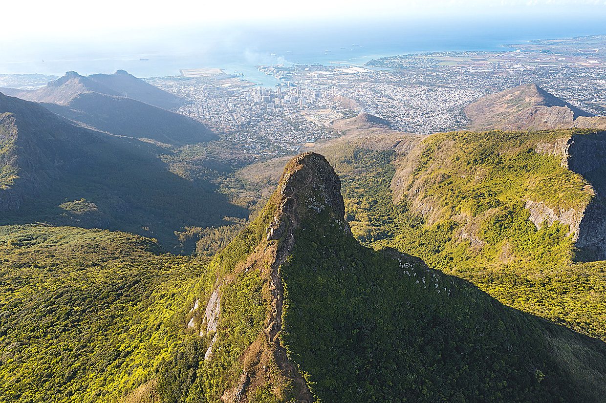 Volcanic peak rising above Port Louis